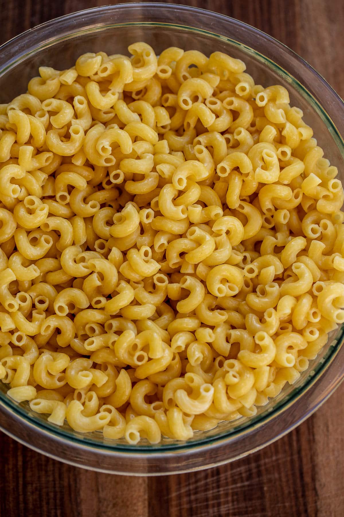Bowl of cooked macaroni tossed with butter