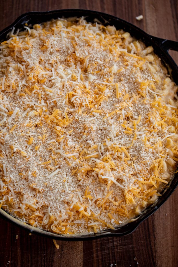 Mac and cheese topped with shredded cheese and breadcrumbs