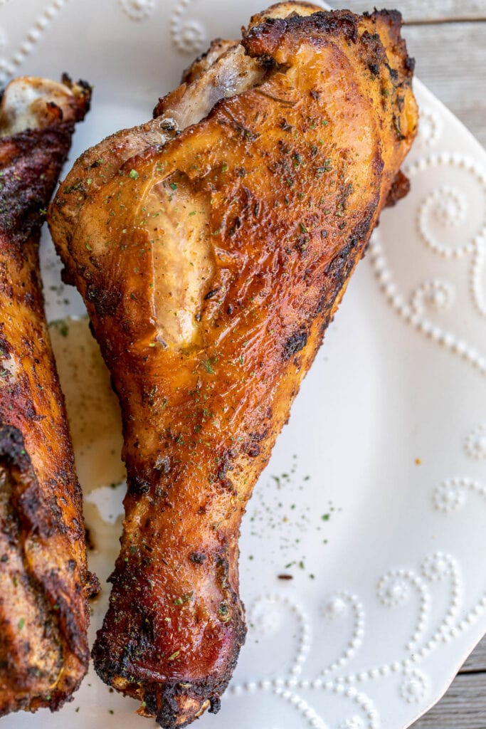 1 turkey drumstick on a white plate.