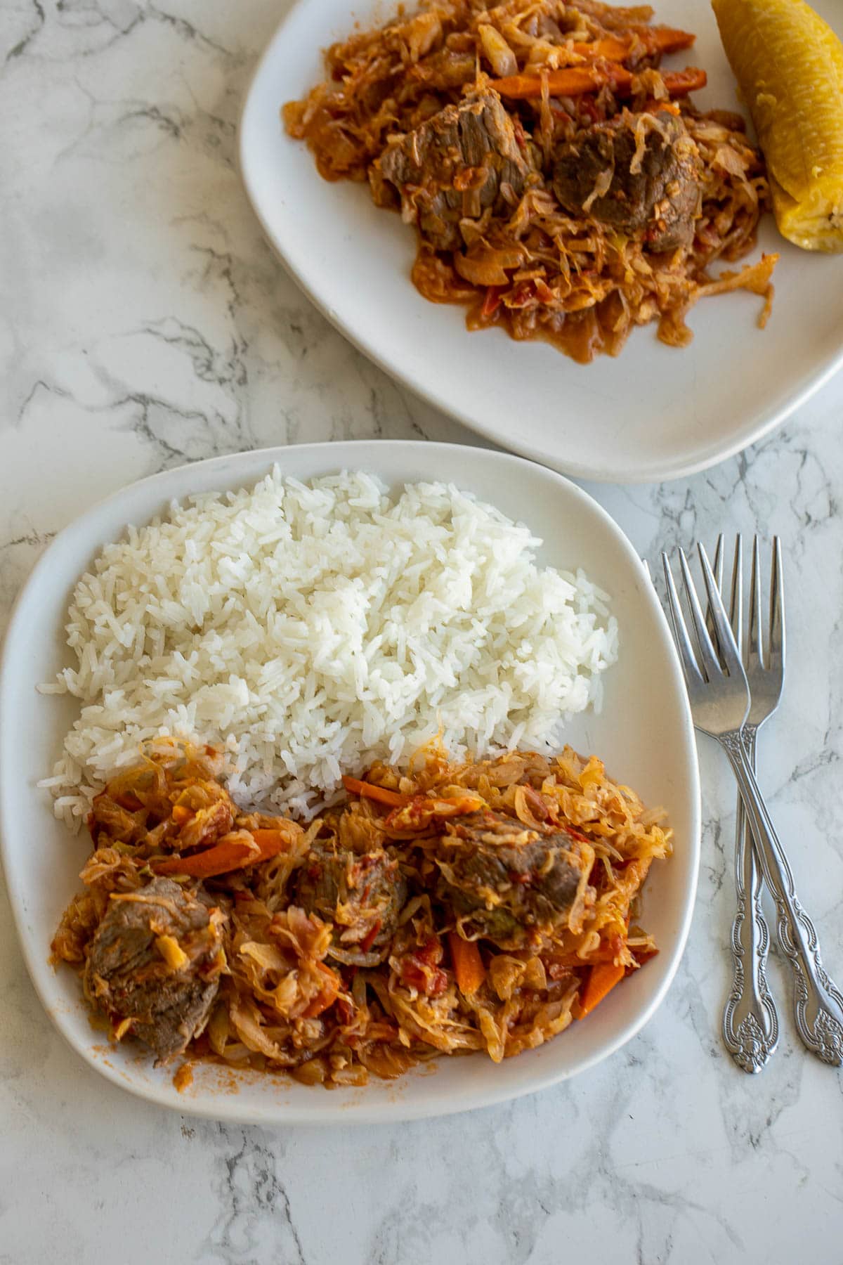 Cabbage Stew served with rice and plantains