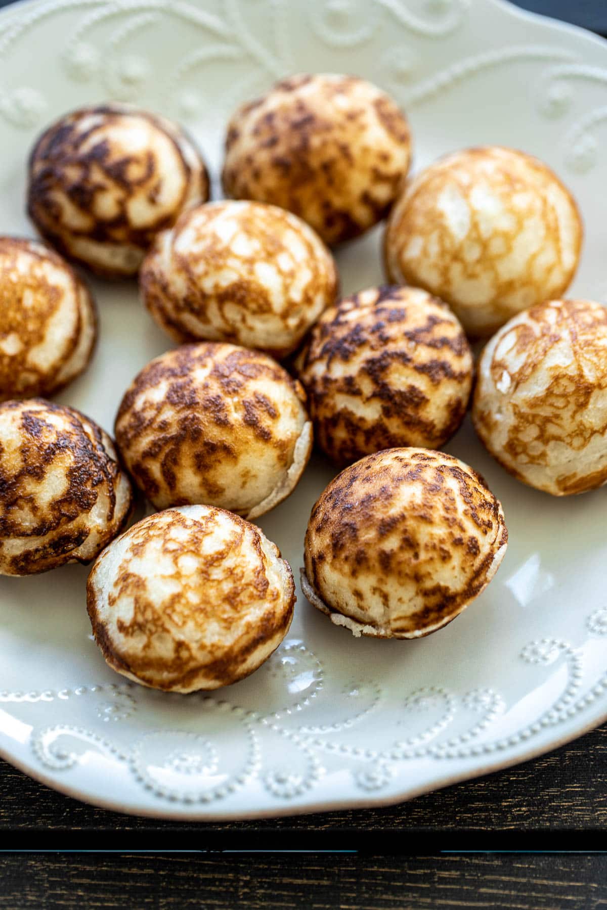 Coconut Rice Pancakes on a white plate.