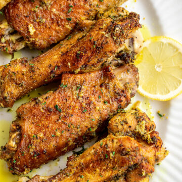 Lemon pepper turkey wings on a serving platter.