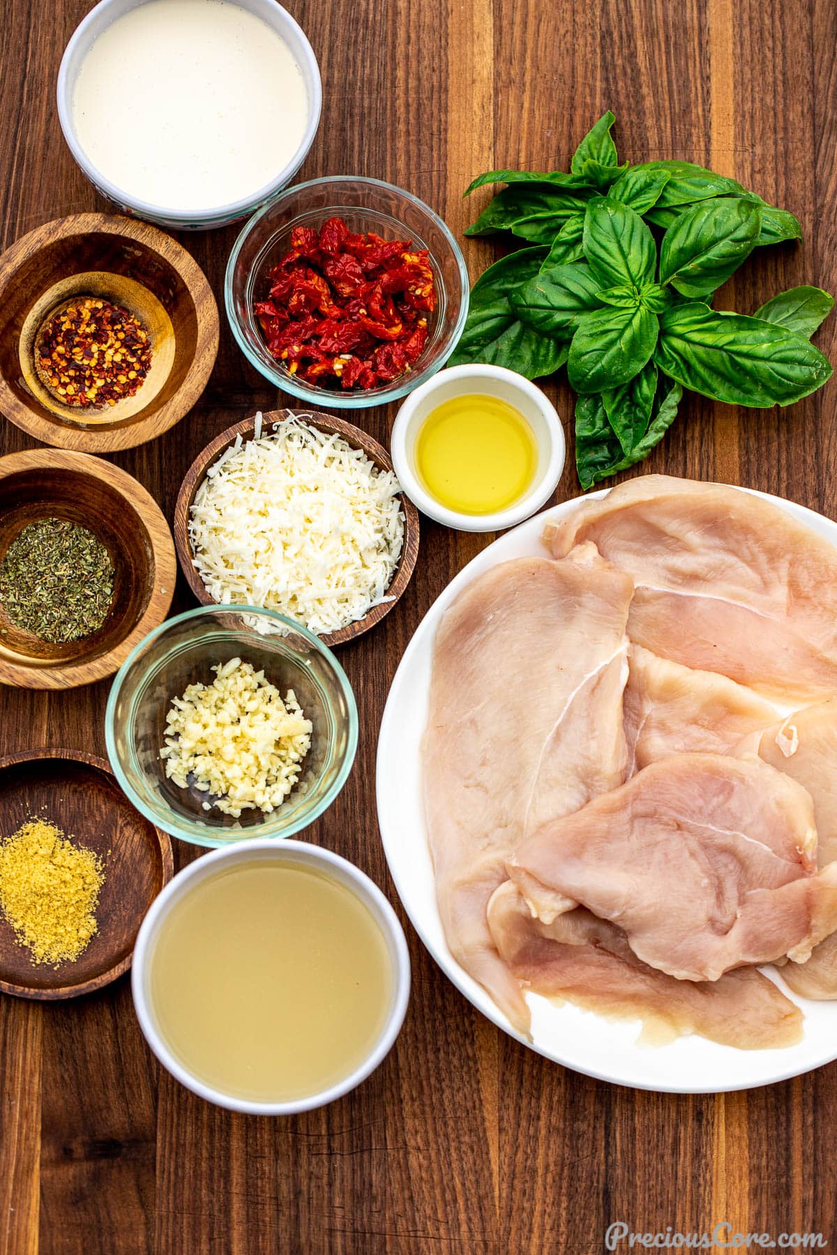 Ingredients for Marry Me Chicken on chopping board.