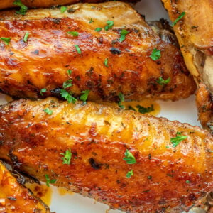 Oven Baked Turkey Wings in a white bowl.