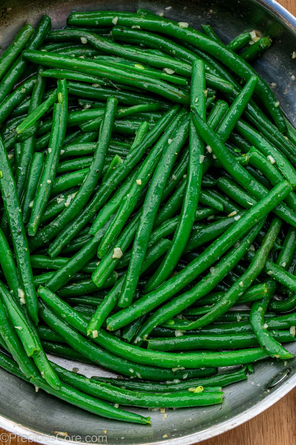 Skillet of garlic butter green beans.