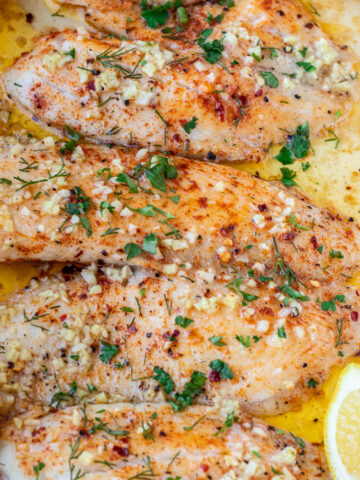 Square image of baked lemon butter tilapia.