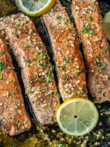 Cooked salmon in pan.