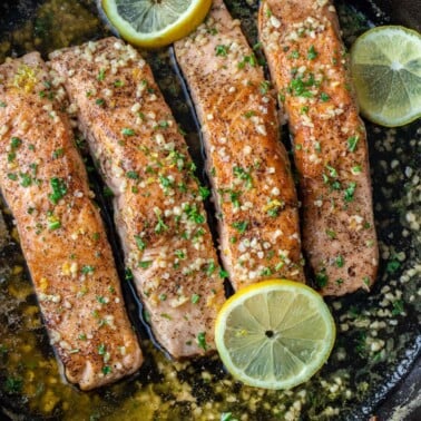 Cooked salmon in pan.