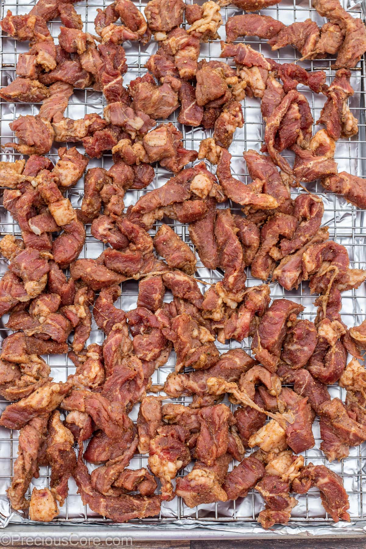 Beef on a baking sheet rack.