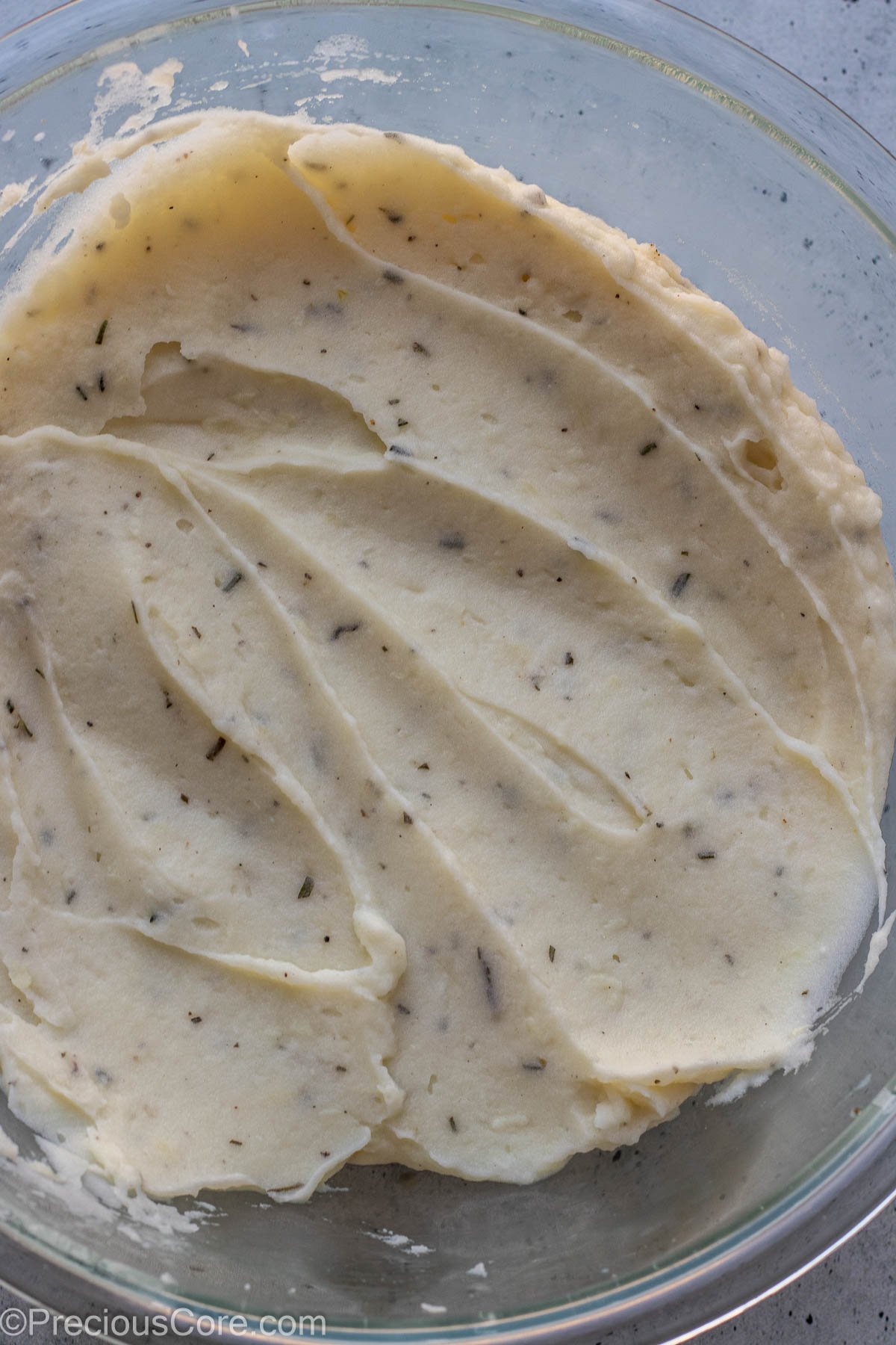 Rosemary garlic mashed potatoes in a large mixing bowl.