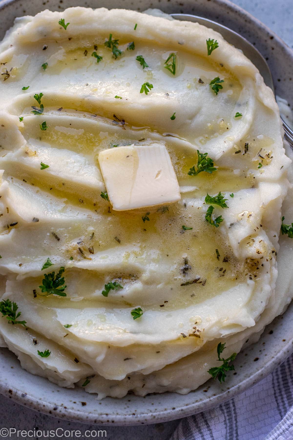 Close up shot of mashed potatoes in a bowl.