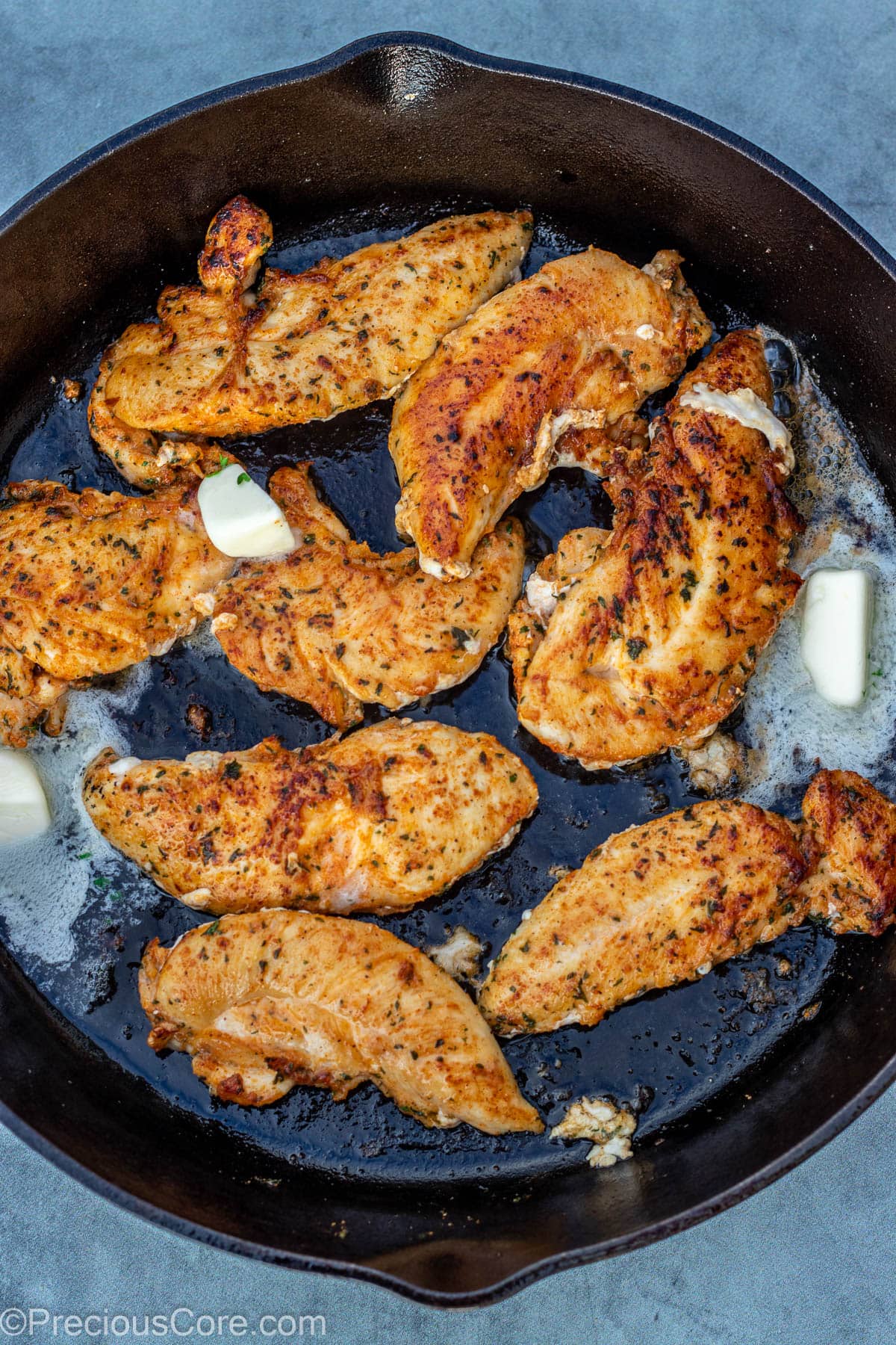 Butter in pan with chicken.