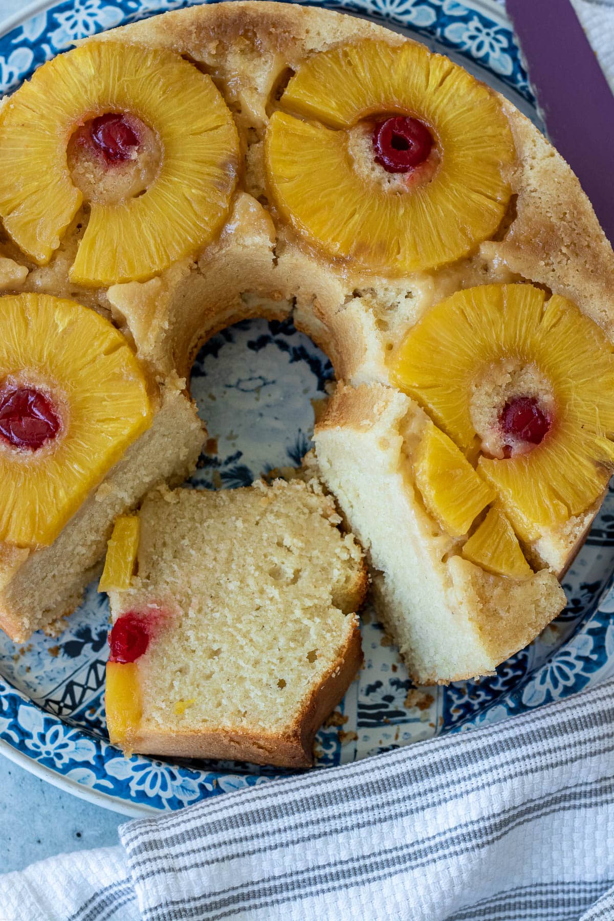 Pineapple Upside Down Pound Cake with pineapple slices and maraschino cherries.