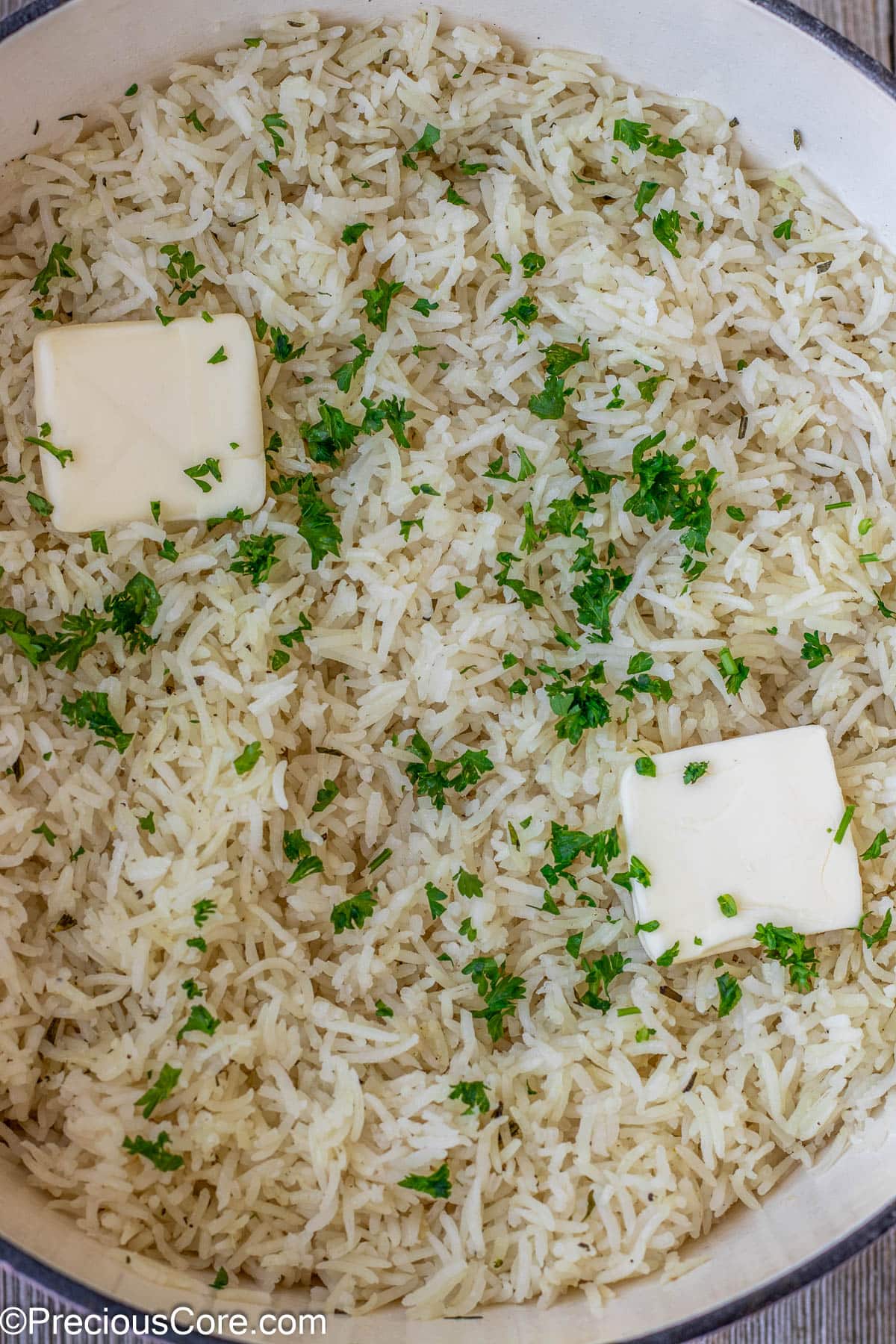 Rice topped with butter and minced parsley.
