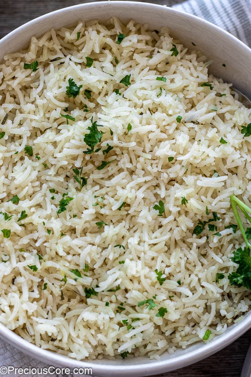 Cooked rice in a white bowl.