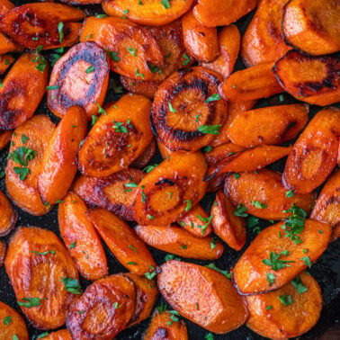 Square image of cooked carrots.