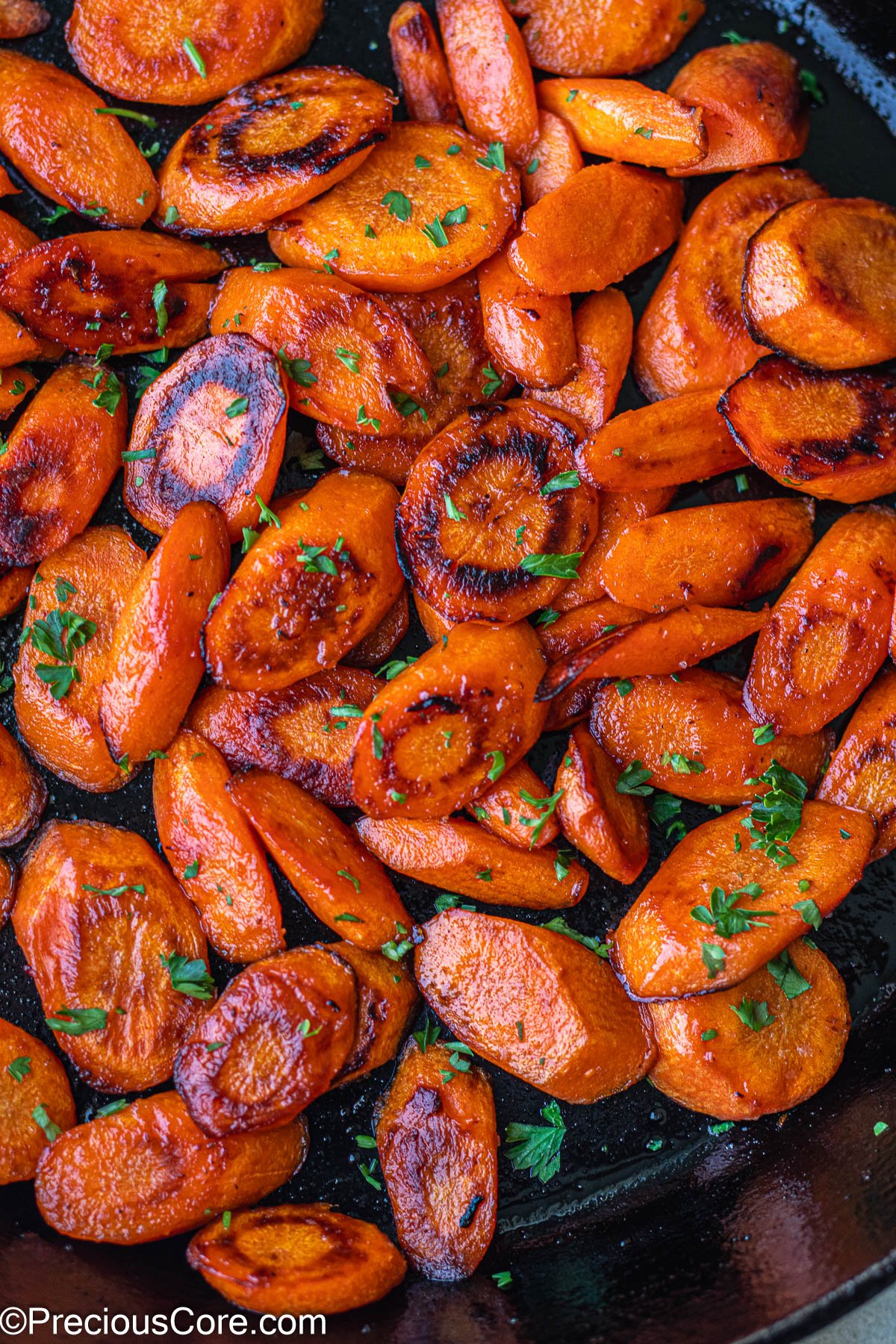 Fried Carrots in a cast iron skillet.