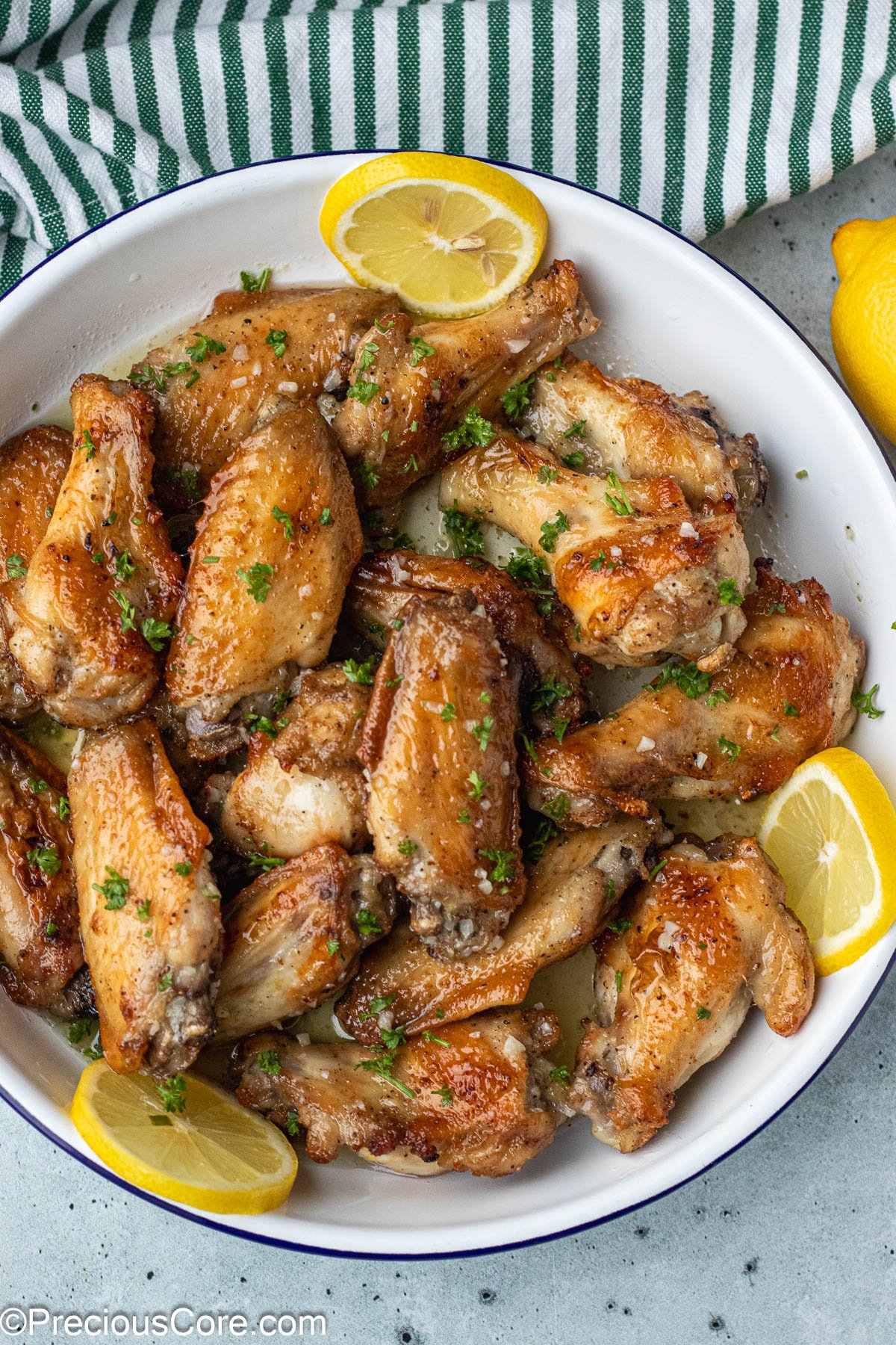 Chicken garnished with minced parsley.