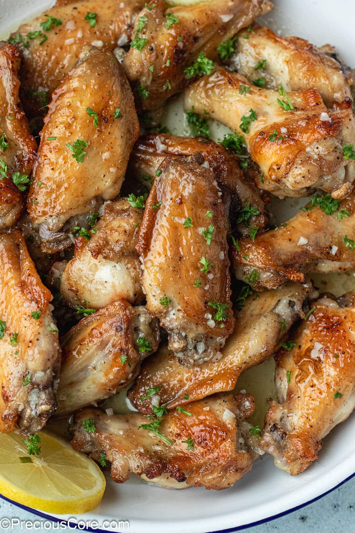 Garlic Butter Wings in a white dish.