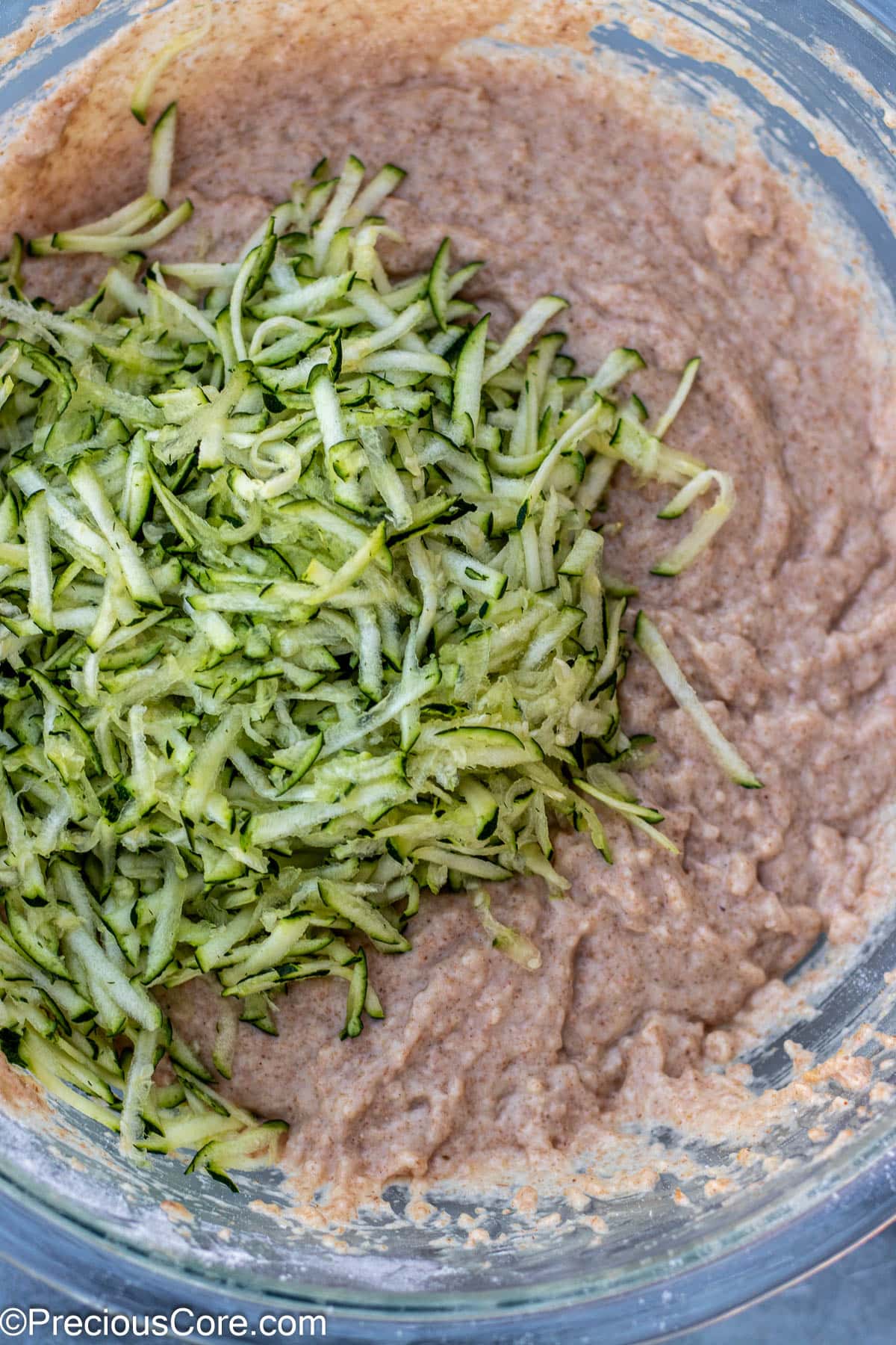 Shredded zucchini added to batter.