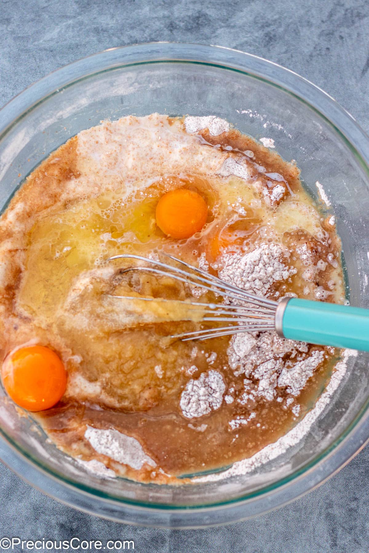 Wet ingredients for muffins in a bowl.