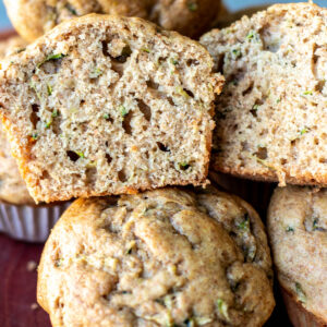 Zucchini muffin cut in half to show texture.