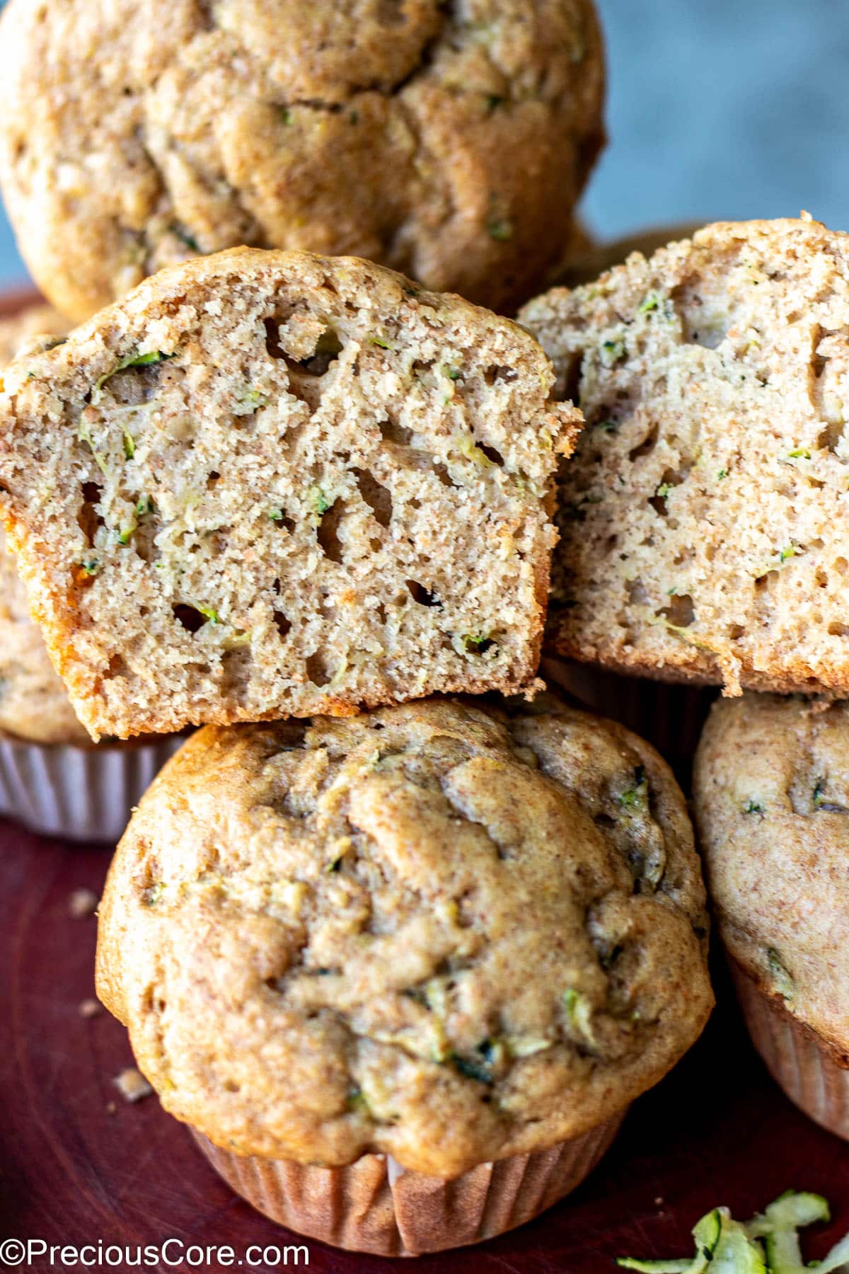 Zucchini muffin cut in half to show texture.