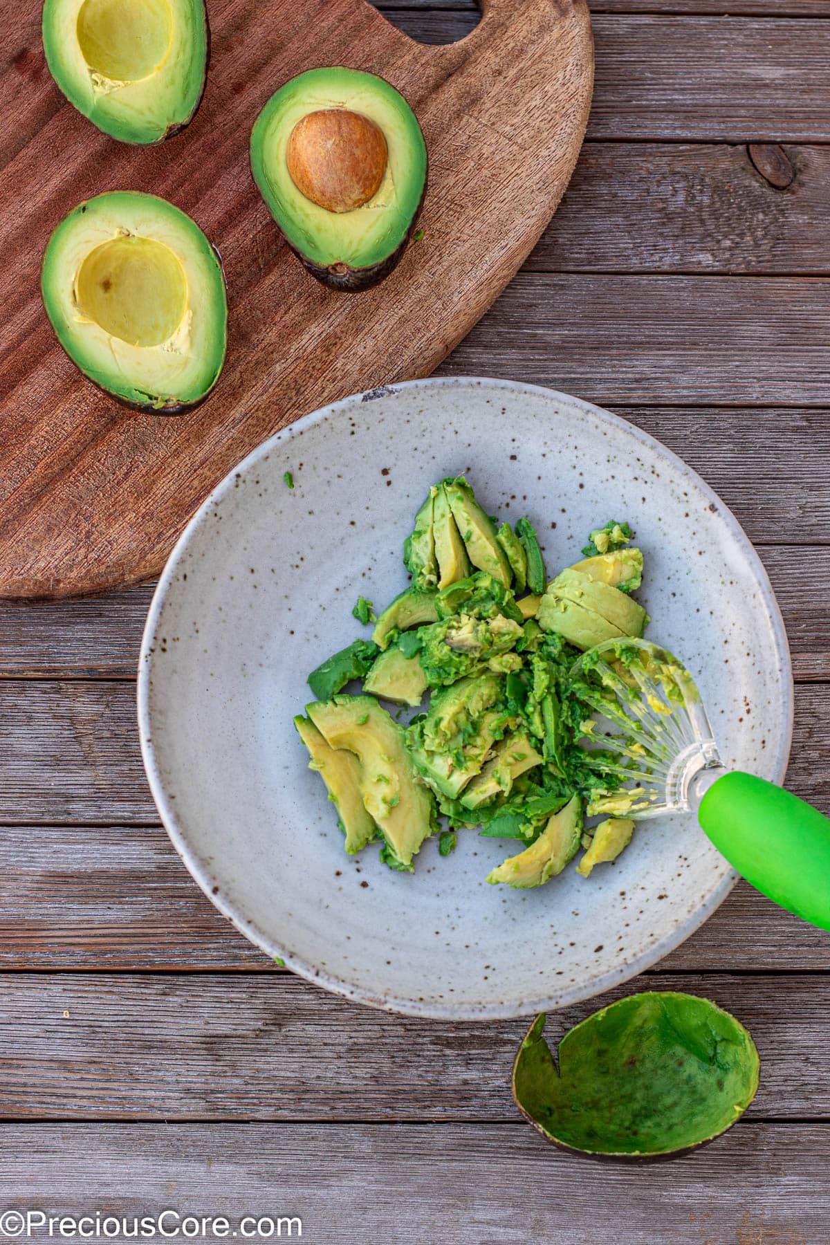 Scooped avocado in a bowl.