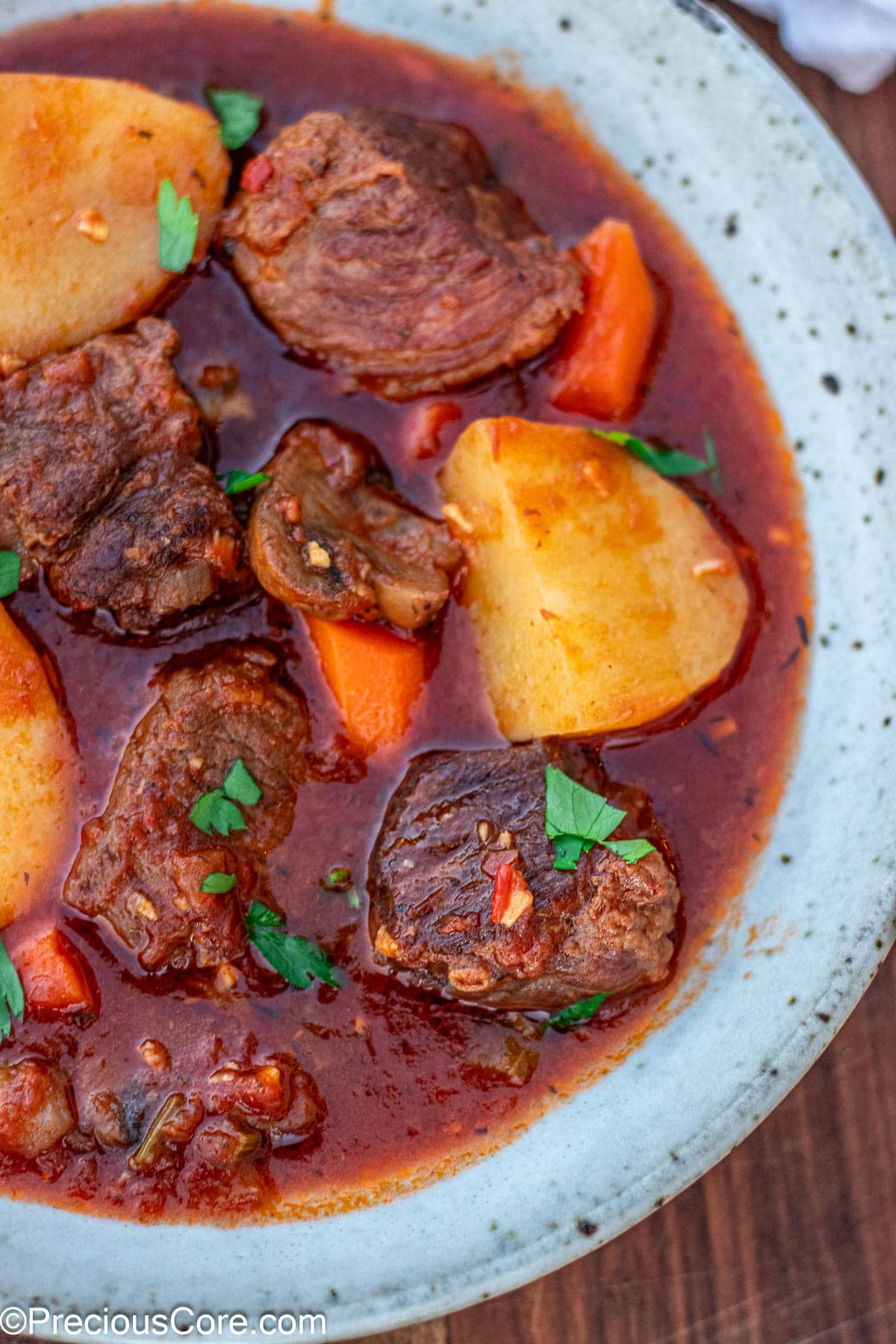 Side shot of beef stew without wine in a bowl.