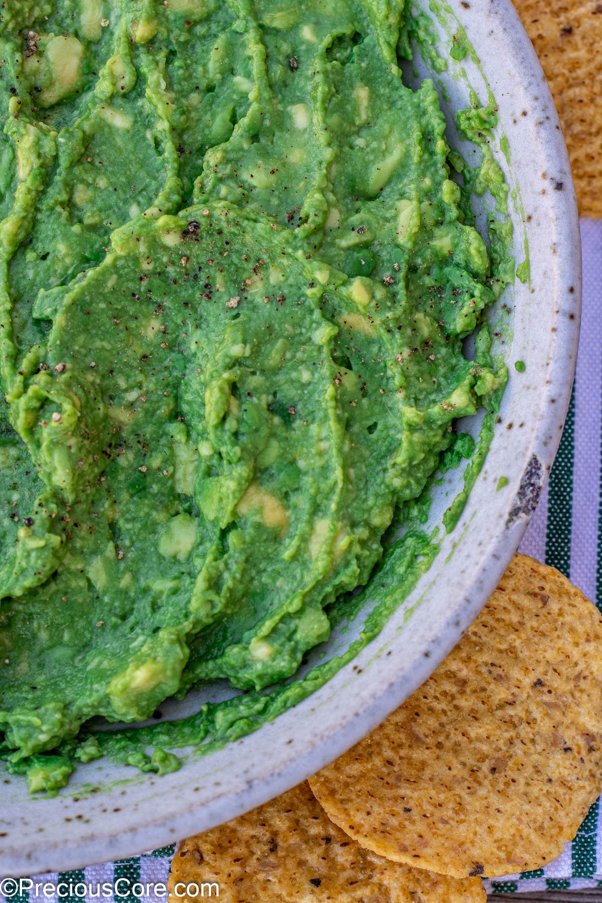 4 ingredient guacamole recipe, served with tortilla chips.