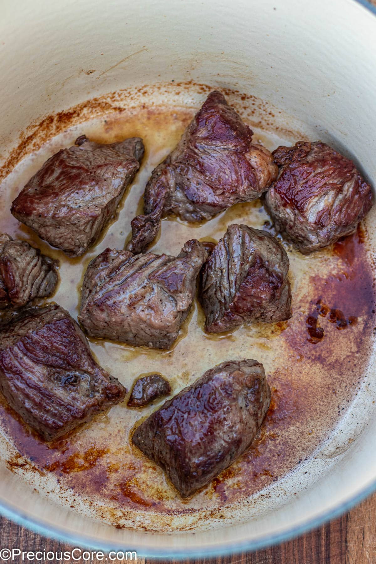 Beef browning in a dutch oven.
