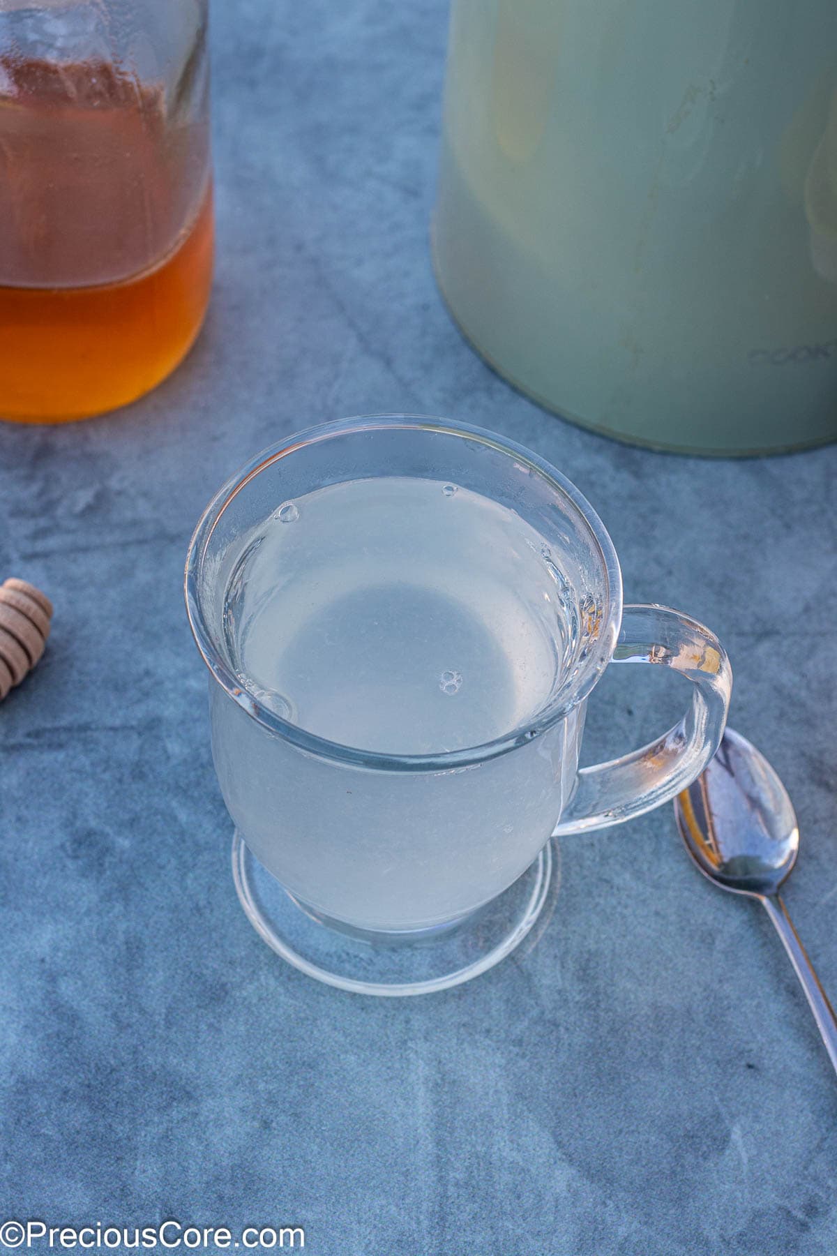 Mug containing lemon juice and water.