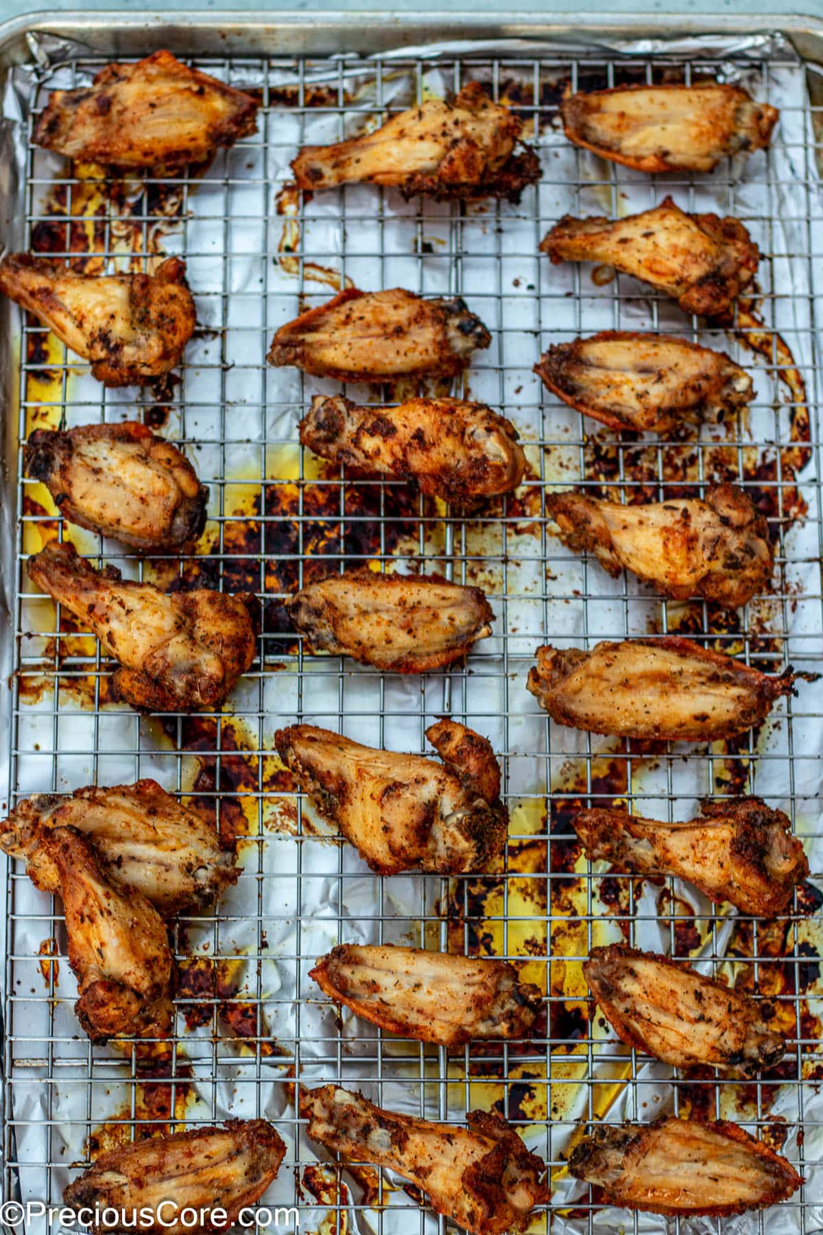 Baked chicken on oven-safe rack.