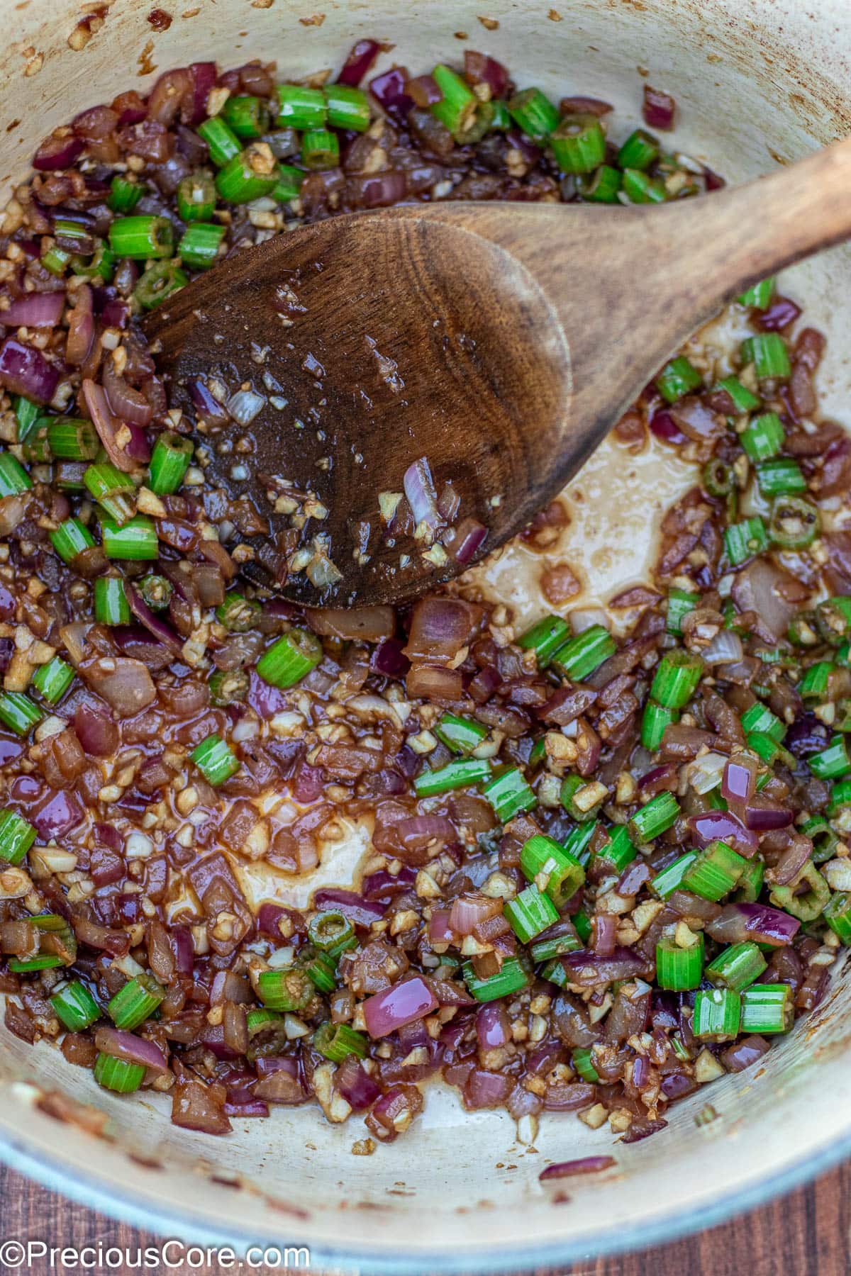 Onions and celery cooking in Dutch oven.