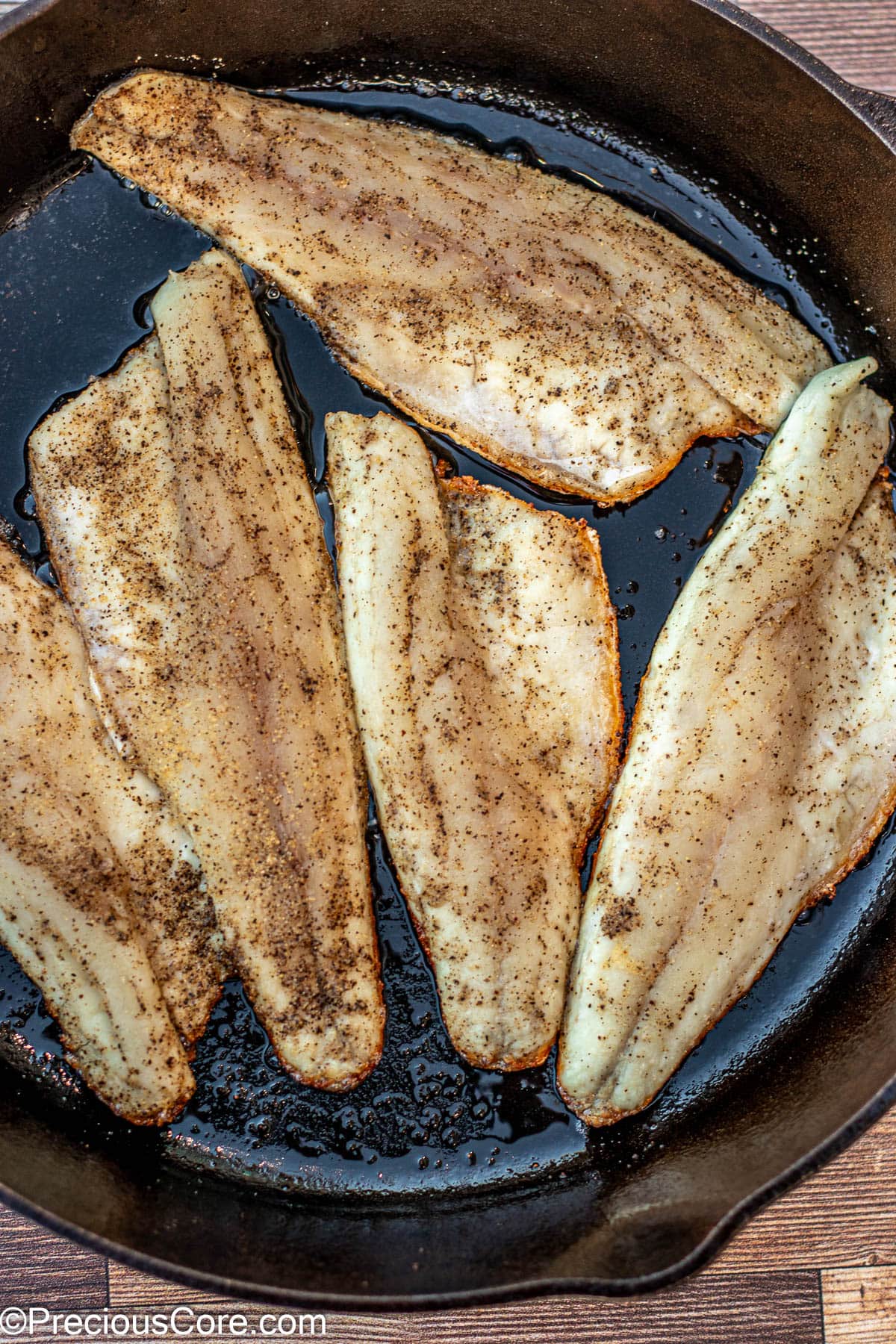 Fish filets in 12 inch cast iron skillet.