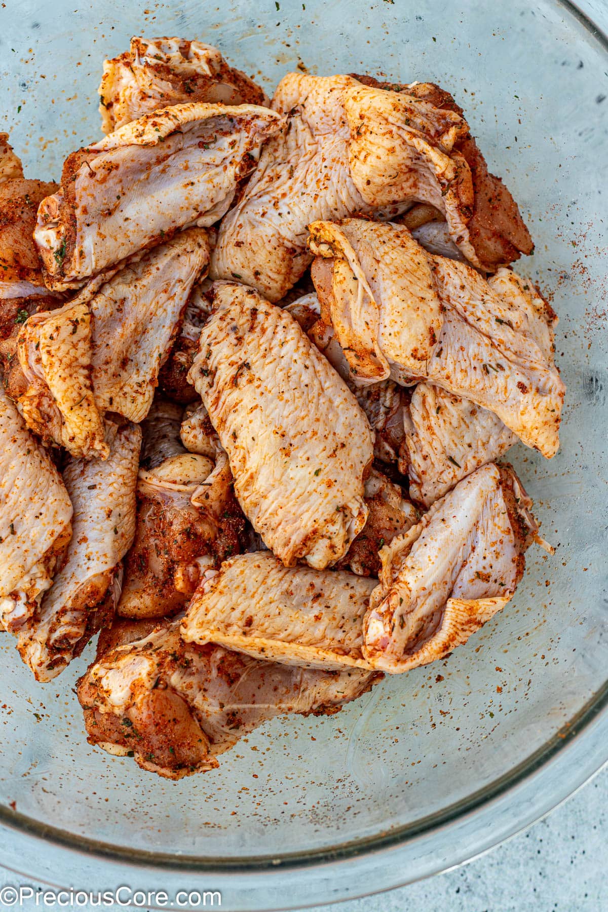 Seasoned chicken in a bowl.