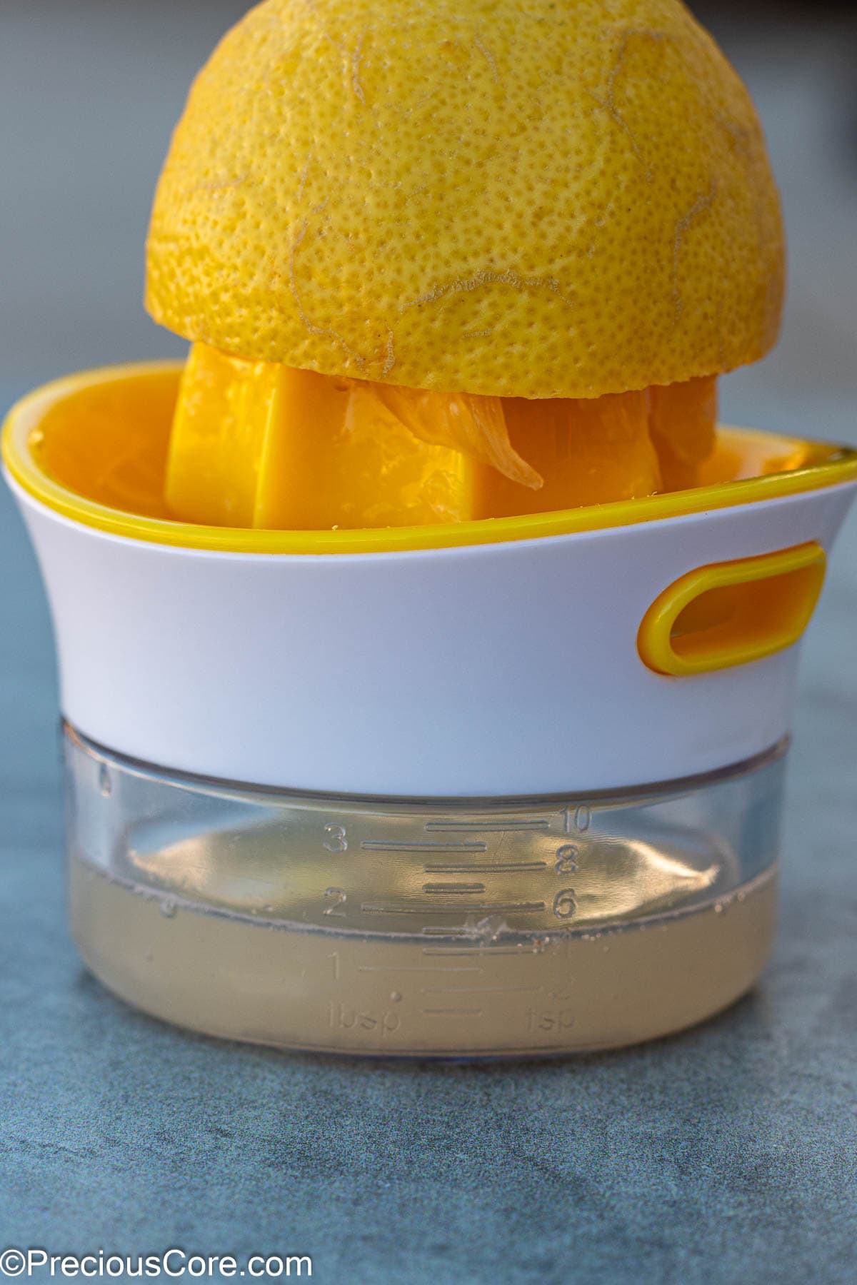 Fresh lemon juice squeezed with a lemon squeezer.