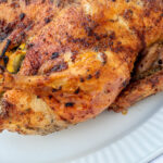 Herb Roasted Duck on a white serving tray.