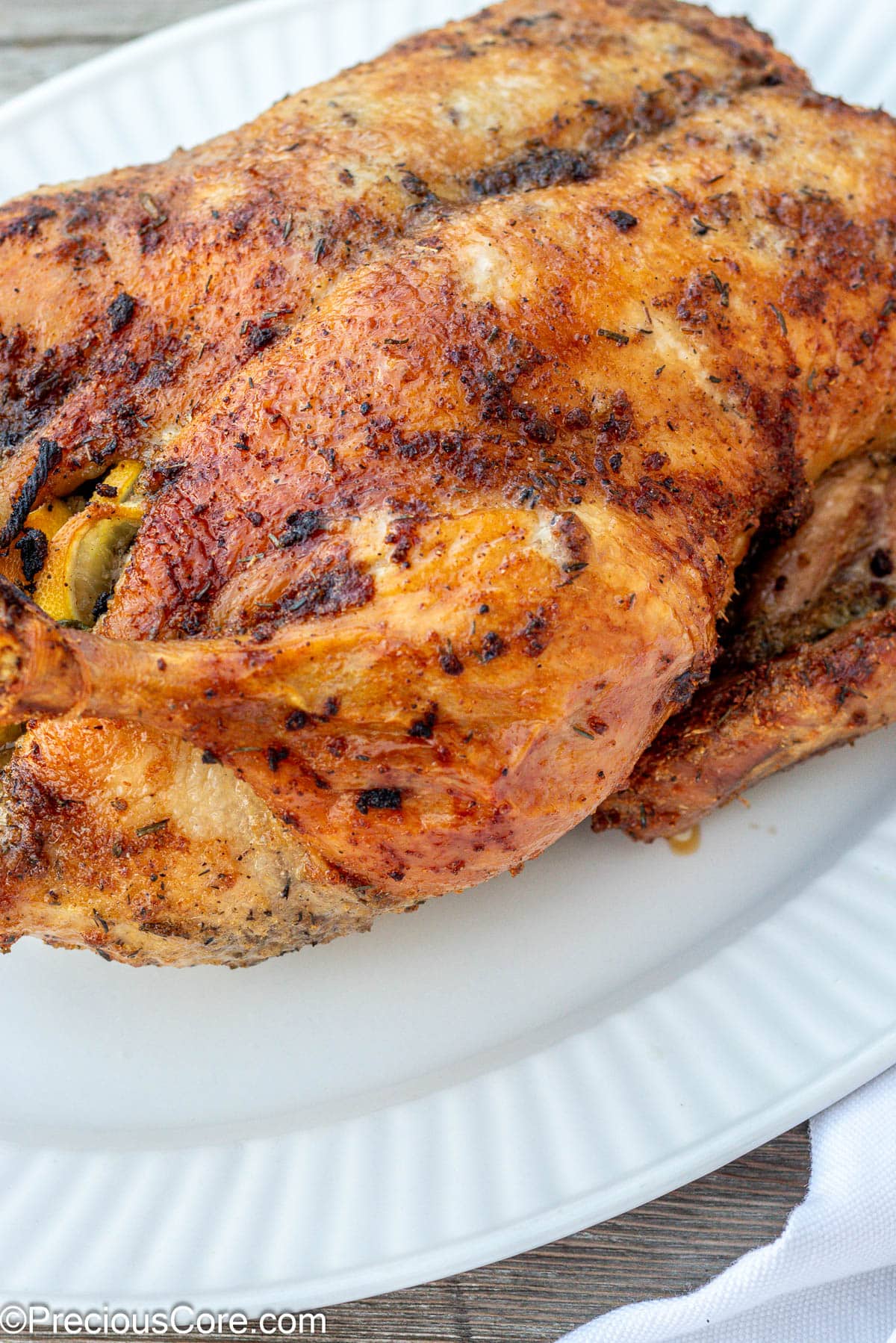 Herb Roasted Duck on a white serving tray.