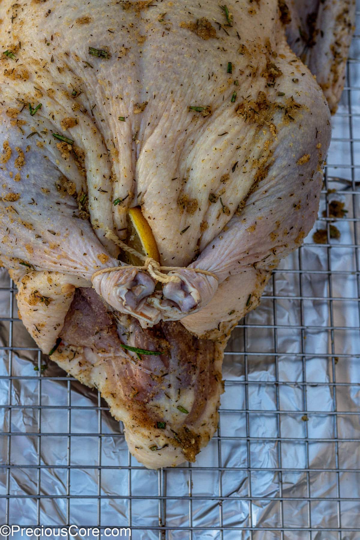 Duck legs tied with butcher twine.