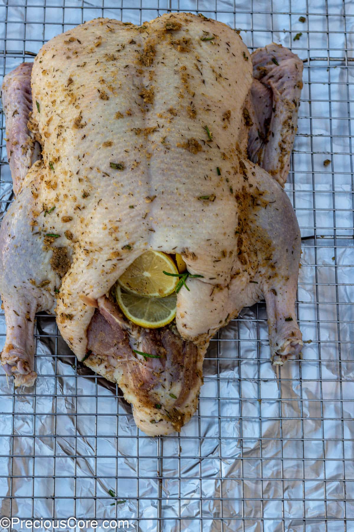 Whole duck seasoned with herbs and spices.