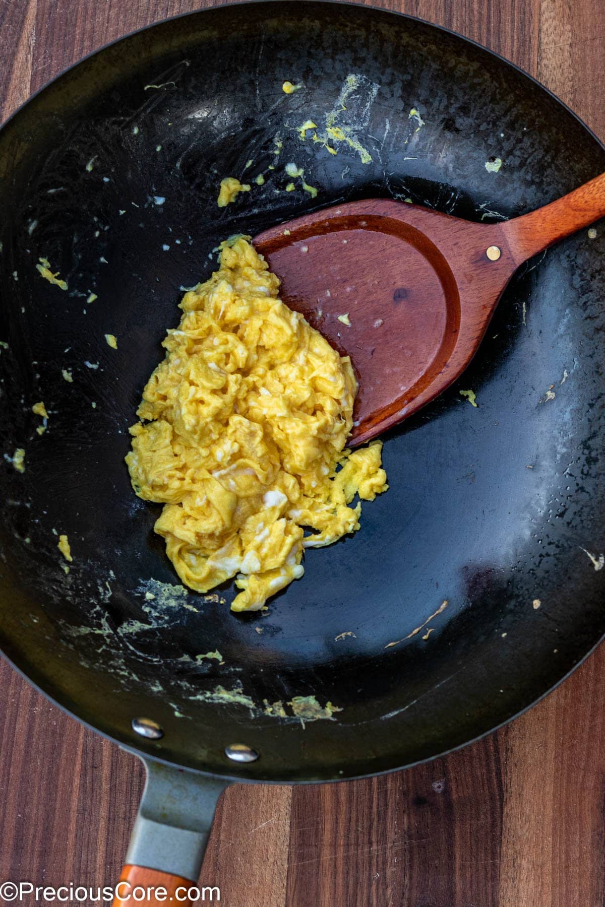 Scrambled eggs in a wok.