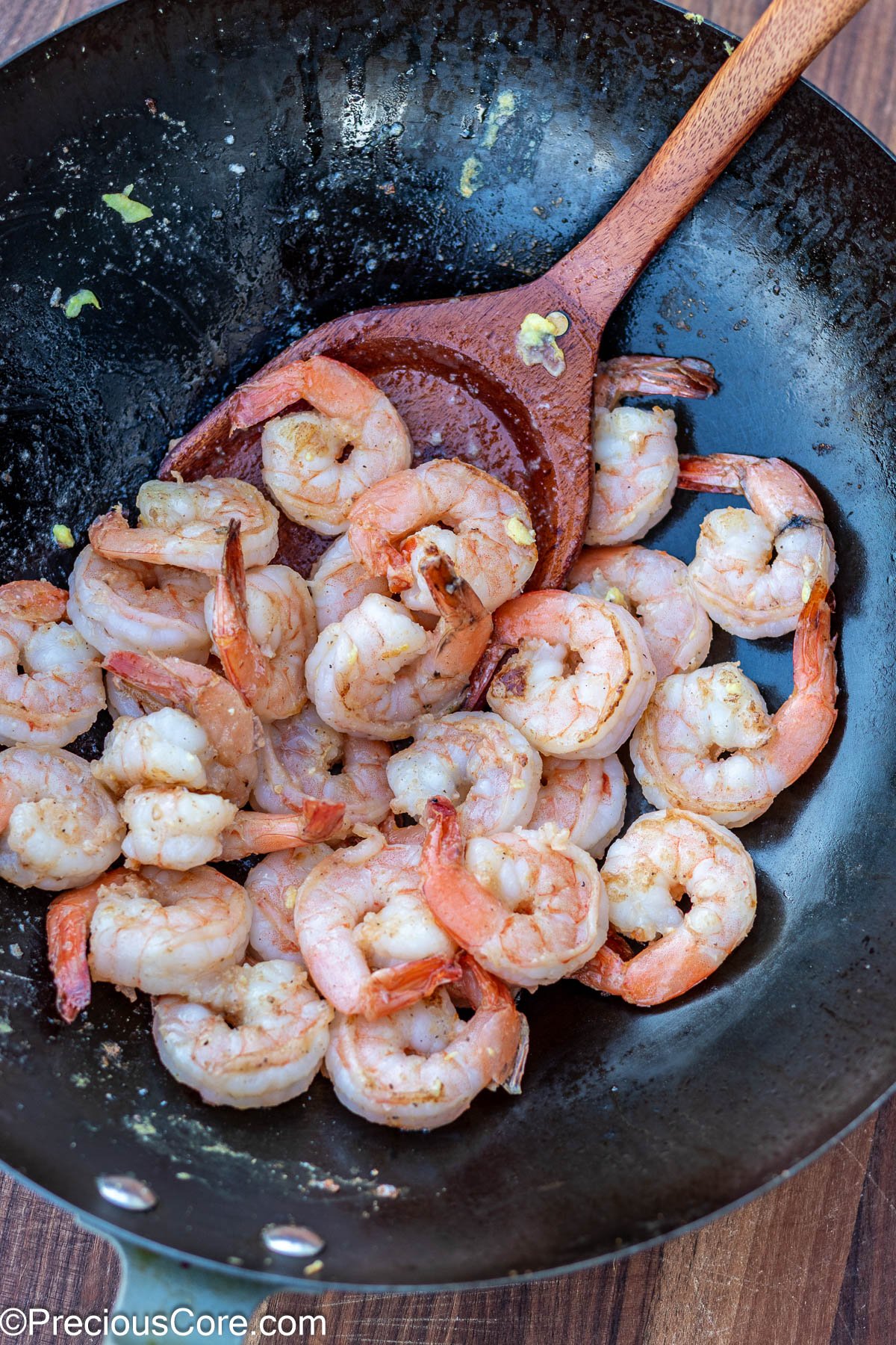 Cooked shrimp in a wok.