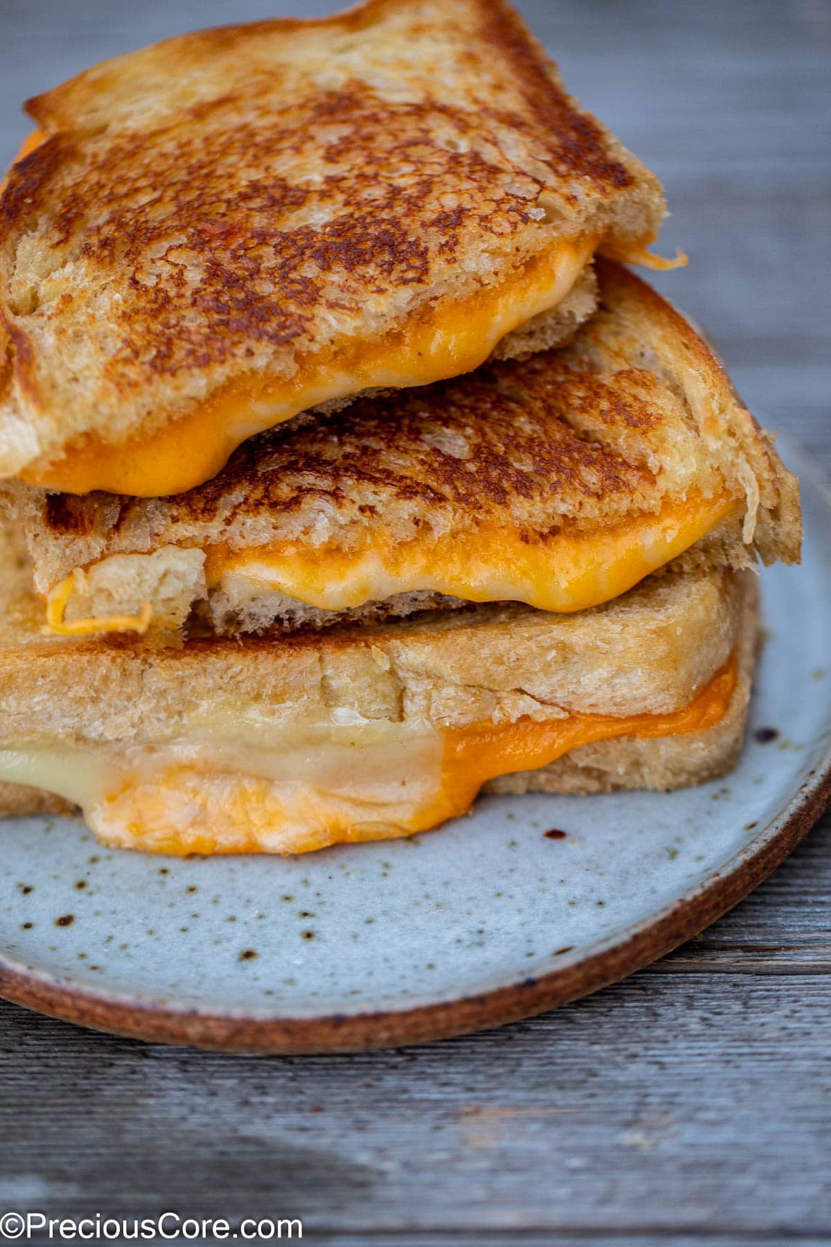 A stack of slices of grilled cheese.