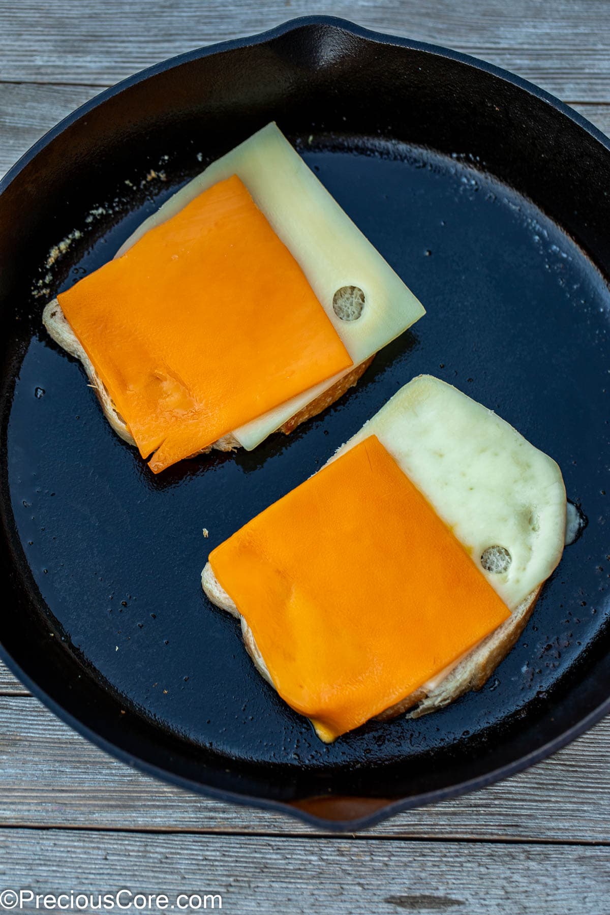 Slices of cheese on bread slices.