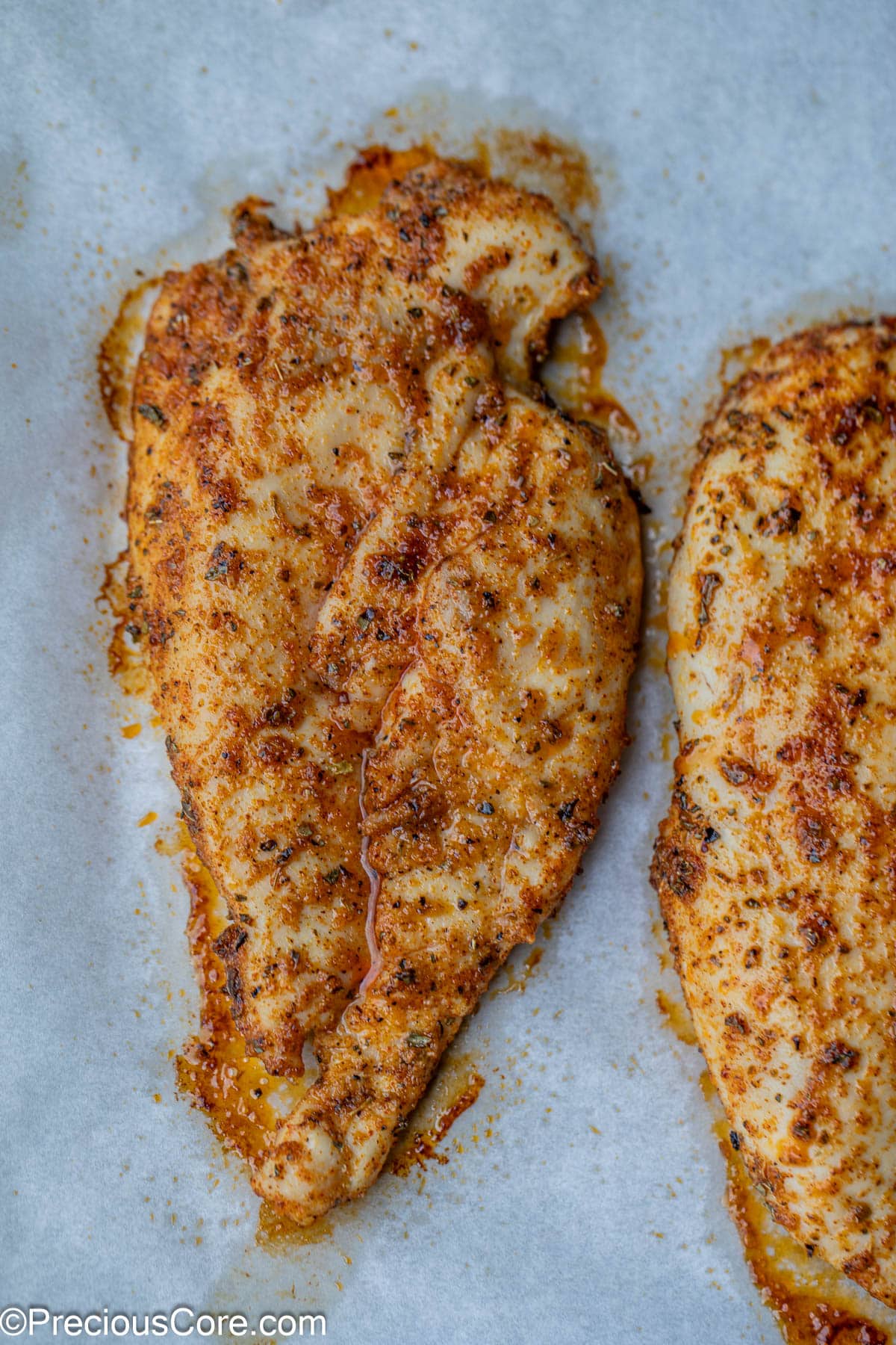 Close-up of a cooked thin chicken breast.