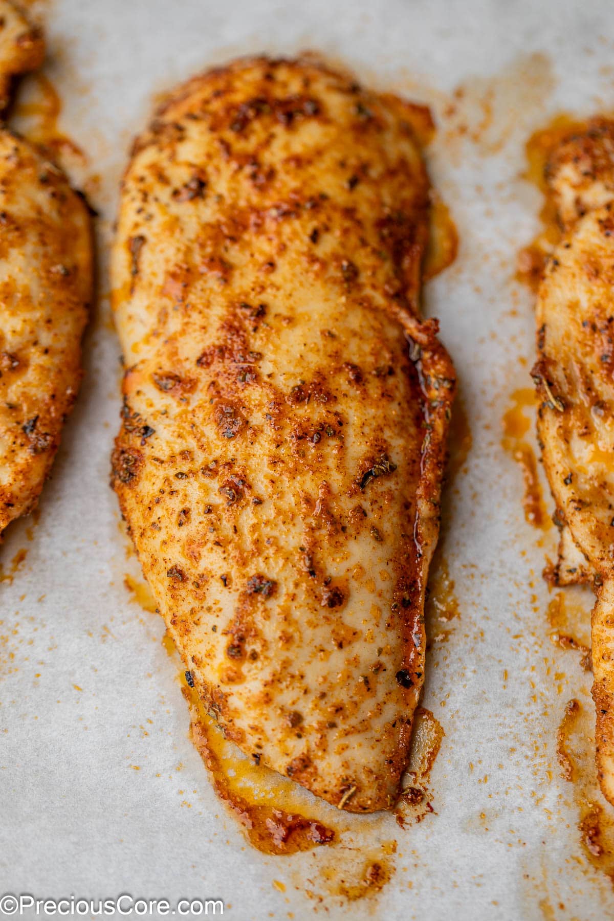 Close-up of juicy baked chicken.
