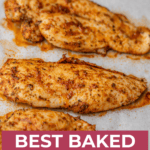 Baked thinly sliced chicken breasts on baking sheet.