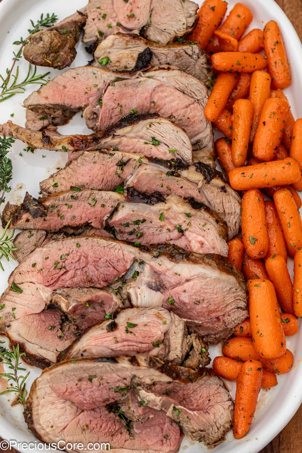 Tasty lamb on a serving platter with glazed carrots.