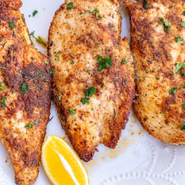 Square image of seared chicken breasts.